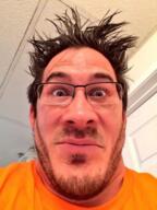 closed_mouth edited glasses irl looking_at_you markiplier neutral orange_shirt photo stubble variant:markiplier_soyjak // 400x533 // 323.9KB