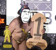 2015 2soyjaks angry arm award closed_mouth clothes comic_sans ear glasses gold hair hand irl leg naked nsfw penis small_penis smallest_pecker_award soyjak statue subvariant:chudjak_front subvariant:hornyson subvariant:obsessedchud text trophy twp variant:chudjak variant:cobson // 750x667 // 283.0KB