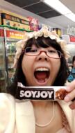 asian candy chocolate female glasses hair holding_object irl japanese_text large_nose open_mouth soy soyjak text tongue variant:joyjak // 539x960 // 661.5KB